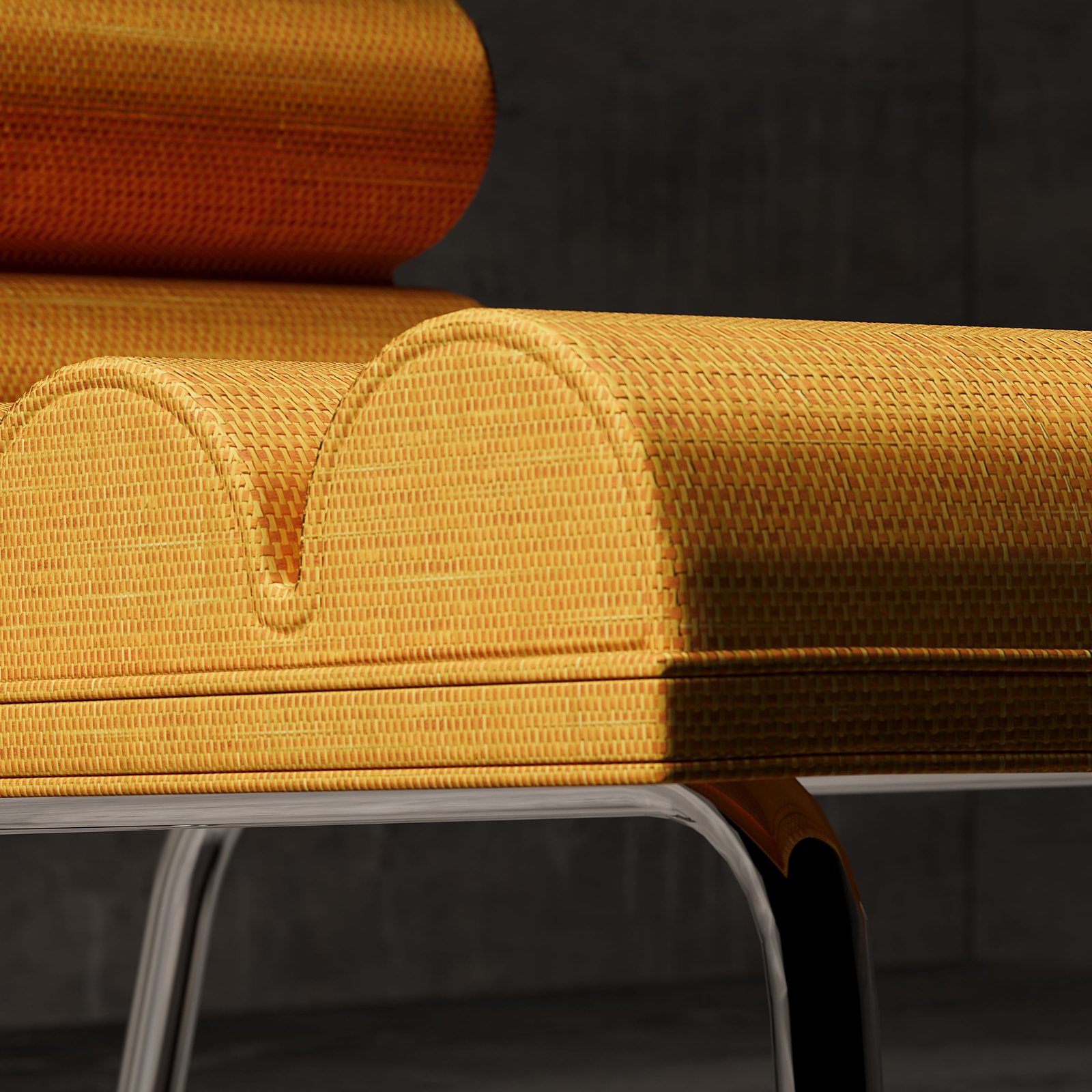Détail d'un fauteuil contemporain en tissu jaune sur piètement métal